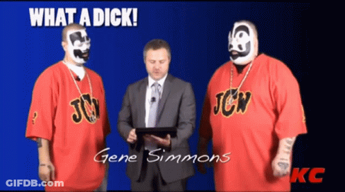 Two Men In Red JCW Shirts Standing Together GIF