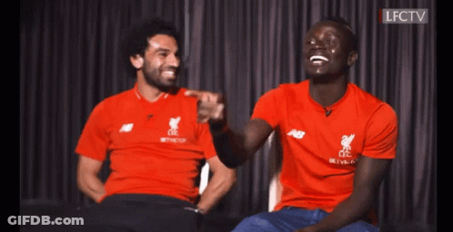 Two Men In Red LFC Shirts Laughing GIF