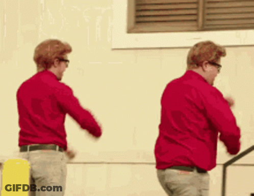 Two Men In Red Shirts Dancing GIF