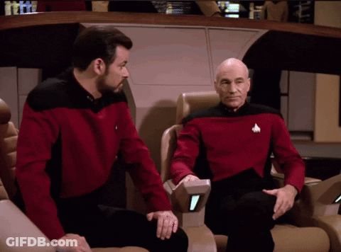 Two Men In Red Shirts Sitting GIF