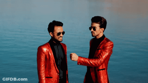 Two Men In Red Suits And Sunglasses GIF