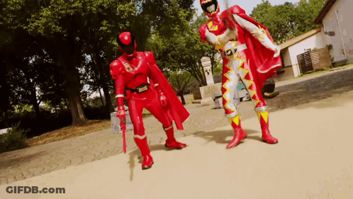 Two Men In Red Superhero Costumes GIF
