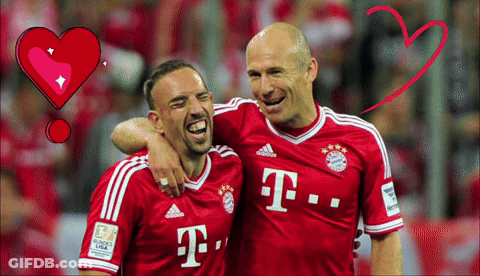 Two Men In Red T-Mobile Jerseys Are Hugging GIF