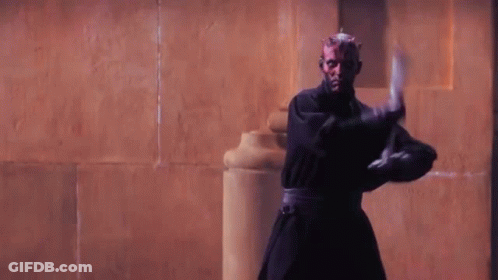 Two Men In Robes Standing Together GIF