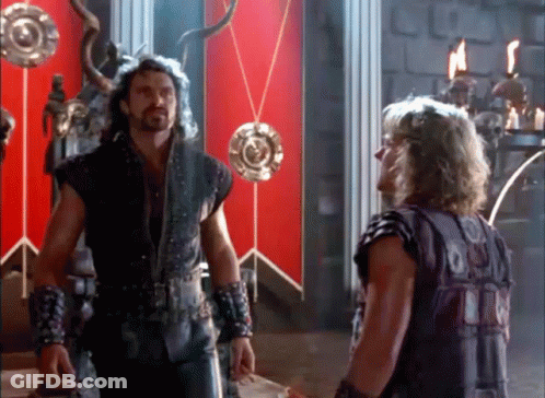 Two Men In Room With Red Wall GIF