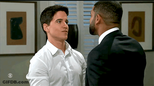 Two Men In Suit And White Shirt Looking At Each Other GIF