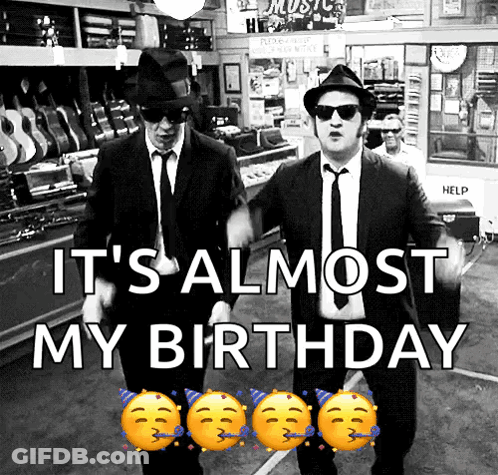 Two Men In Suits And Hats Are Dancing In A Store With The Words It 'S Almost My Birthday GIF