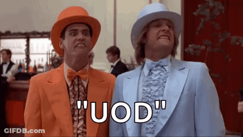 Two Men In Suits And Hats Are Standing Next To Each Other In A Room And Saying Uod . GIF