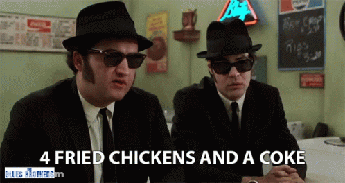 Two Men In Suits And Hats At Table Saying 4 Fried Chickens And A Coke GIF