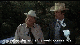 Two Men In Suits And Hats GIF