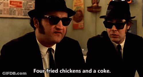 Two Men In Suits And Hats Talking Fried Chicken And Coke GIF