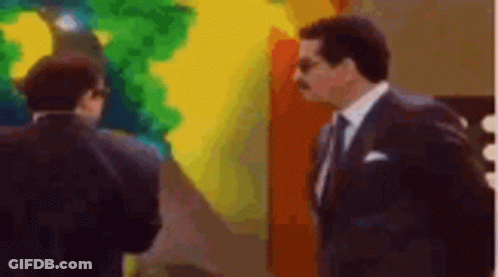 Two Men In Suits And Ties GIF
