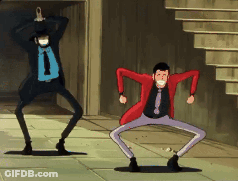 Two Men In Suits And Ties Are Dancing On The Street GIF