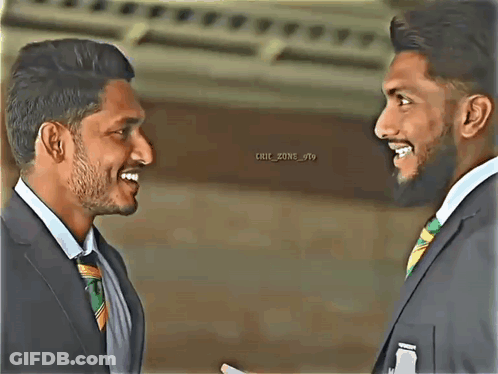 Two Men In Suits And Ties Are Smiling At Each Other And The Words Chic Zone Are On The Bottom Right GIF