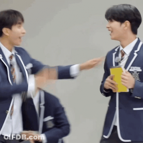Two Men In Suits And Ties Are Standing Next To Each Other . GIF