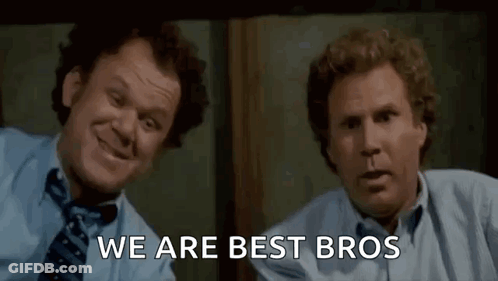 Two Men In Suits Laughing Side By Side GIF