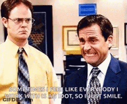 Two Men In Suits And Ties Are Standing Next To Each Other And One Is Smiling . GIF