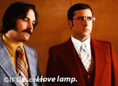Two Men In Suits And Ties Are Standing Next To Each Other And One Of Them Is Saying I Love Lamp GIF