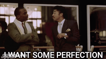 Two Men In Suits And Ties Are Standing Next To Each Other And One Of Them Is Saying I Want Some Perfection . GIF