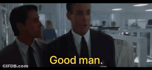 Two Men In Suits And Ties Are Standing Next To Each Other And One Of Them Says Good Man GIF
