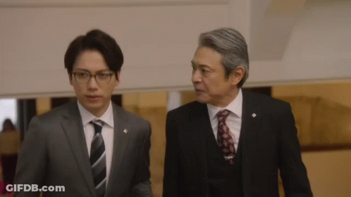 Two Men In Suits Talking GIF