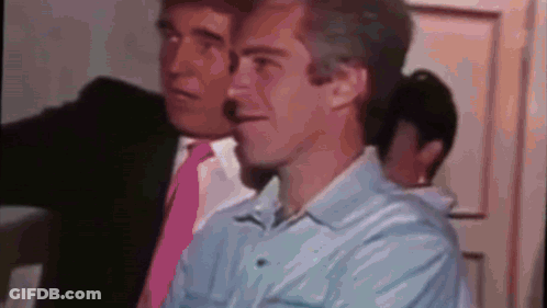 Two Men In Suits And Ties Are Standing Next To Each Other . One Of The Men Is Wearing A Pink Tie . GIF
