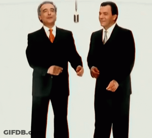Two Men In Suits Shaking Hands GIF