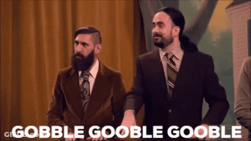 Two Men In Suits Standing With Gobble Goolbe Goolbe Text GIF