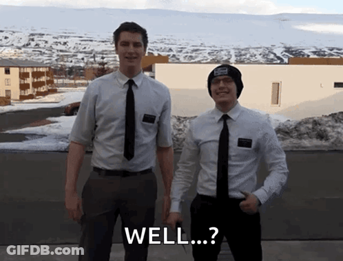 Two Men In Suits And Ties Are Standing Next To Each Other With The Words Well Written On The Bottom GIF