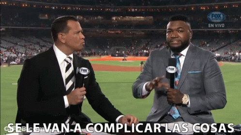 Two Men In Suits And Ties Are Talking In Front Of A Fox Broadcast Of A Baseball Game GIF