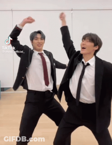 Two Men In Suits And Ties Dancing Hands In Air GIF