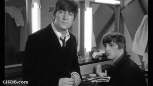 Two Men In Suits And Ties GIF