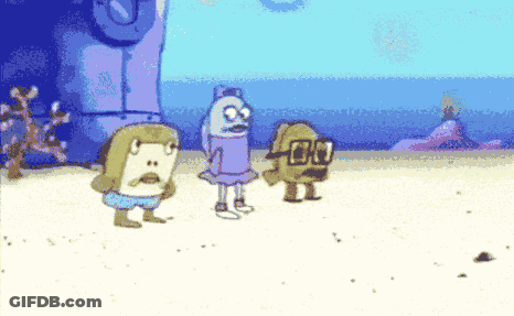 Two Men In Suits And Ties One Smiling GIF