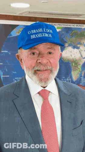 Two Men In Suits And Ties Standing Before Certificates GIF