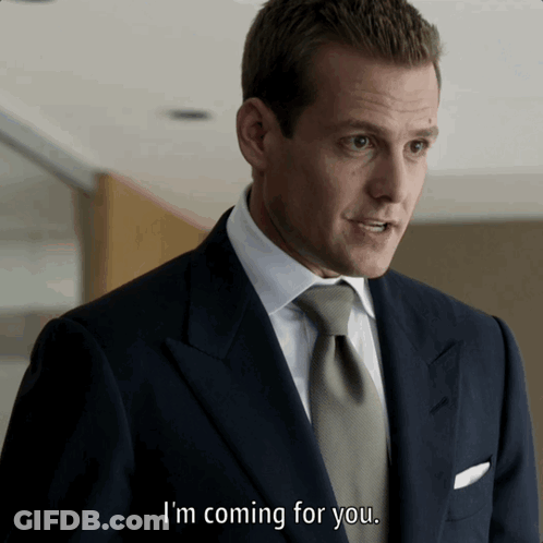 Two Men In Suits And Ties Standing Together GIF