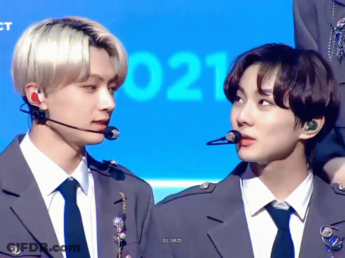 Two Men In Suits And Ties With Number 021 GIF