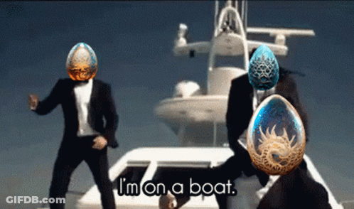 Two Men In Suits Are Dancing In Front Of A Boat With The Words " I 'M On A Boat " On The Bottom GIF