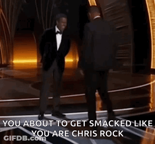 Two Men In Suits Are Dancing On A Stage And One Of Them Says You About To Get Smacked Like You Are Chris Rock . GIF