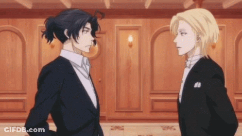 Two Men In Suits Are Standing Next To Each Other And Looking At Each Other . GIF