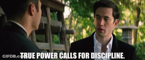 Two Men In Suits Are Talking To Each Other And The Words `` True Power Calls For Discipline '' Are Visible . GIF
