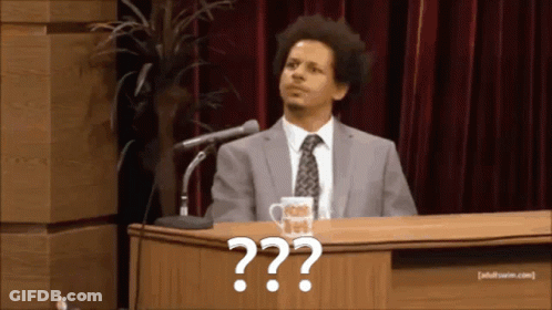 Two Men In Suits At Table With Adult Swim Mug GIF