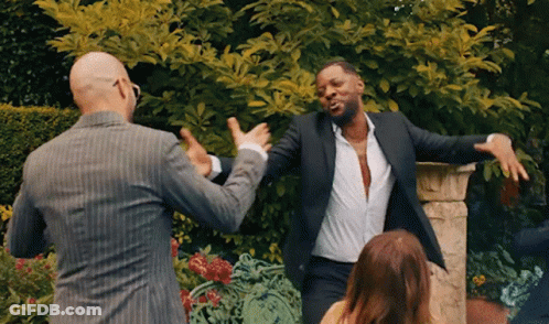 Two Men In Suits Dancing With Woman In Garden GIF