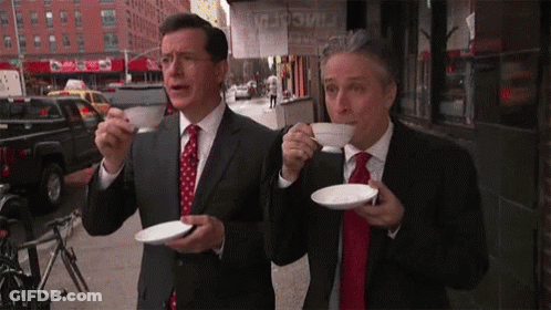 Two Men In Suits Drinking Coffee GIF