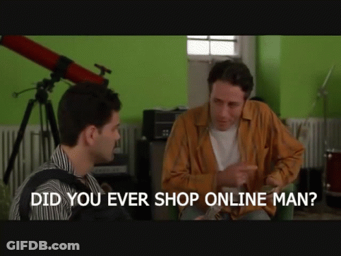Two Men In Suits Holding Coffee On City Street GIF