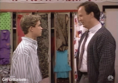 Two Men In Suits In Locker Room GIF