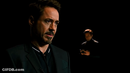 Two Men In Suits In The Dark GIF