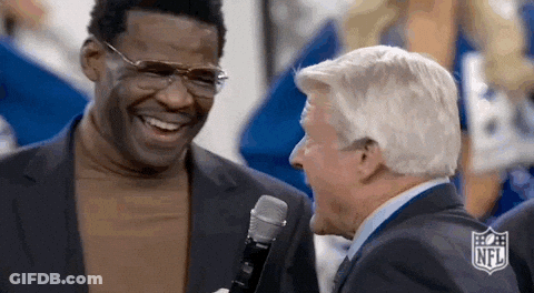 Two Men In Suits Laughing Into Microphone GIF