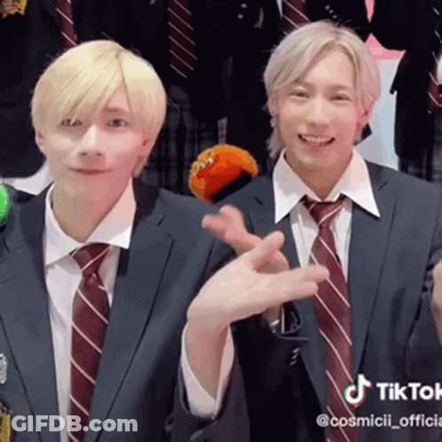 Two Men In Suits Making Peace Sign GIF