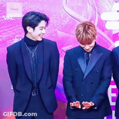 Two Men In Suits On Purple Carpet GIF