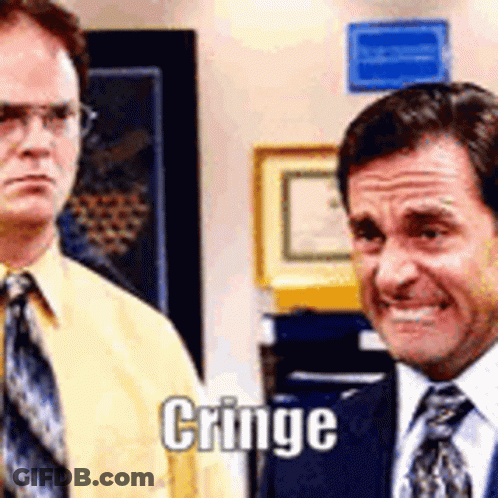 Two Men In Suits One Smiling One Making Face GIF